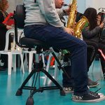 A chair designed specifically for saxophonists. - The SaxSeat